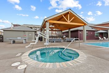 A small pool with a wooden roofed pavilion.